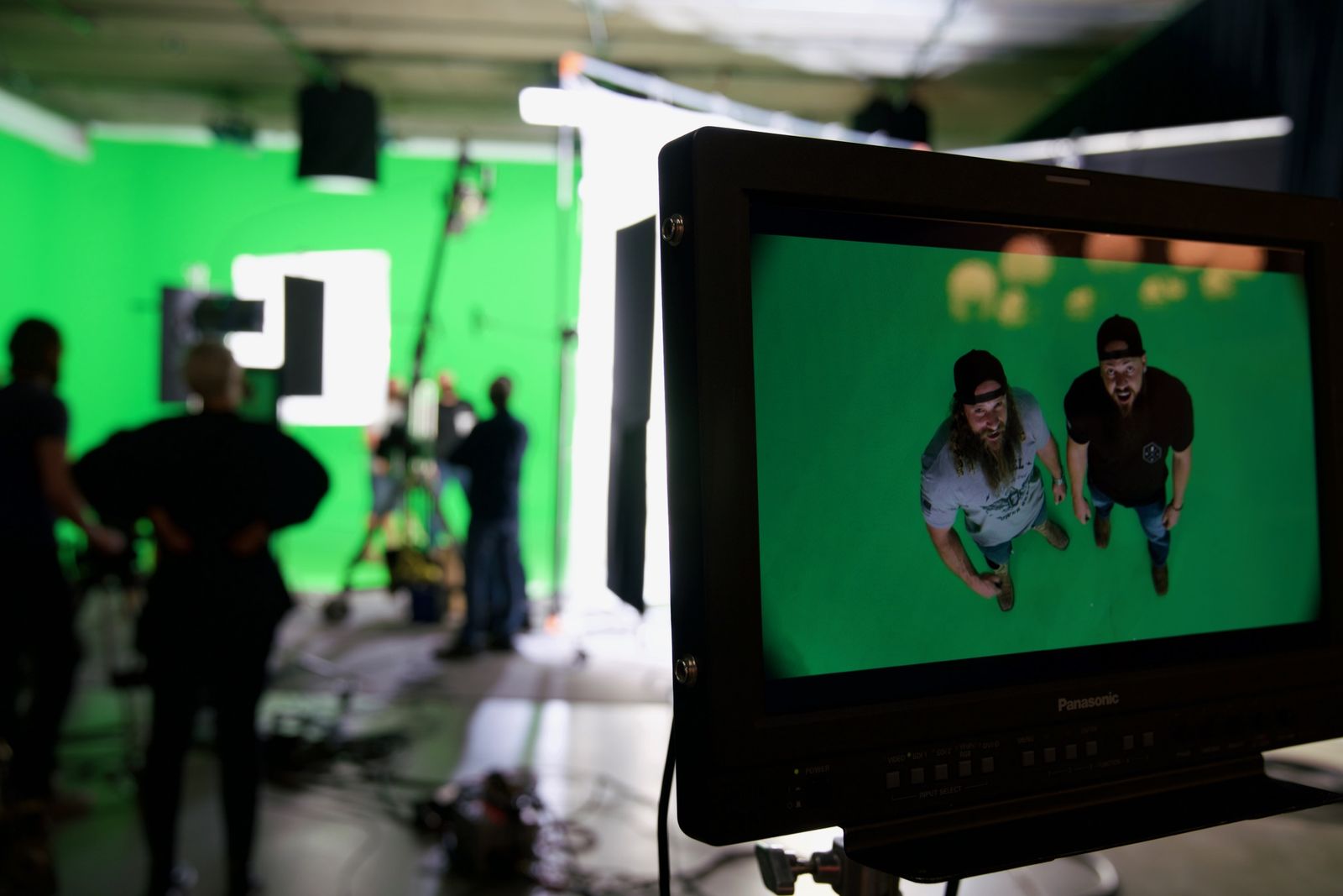 Wide view of the green screen stage with a playback monitor in the foreground