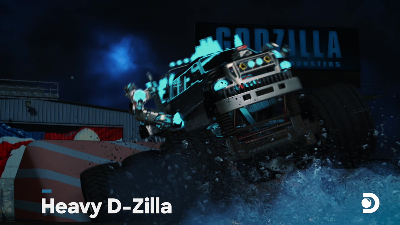 The Heavy D-Zilla monster truck mech in a smashed arena beneath a Godzilla billboard