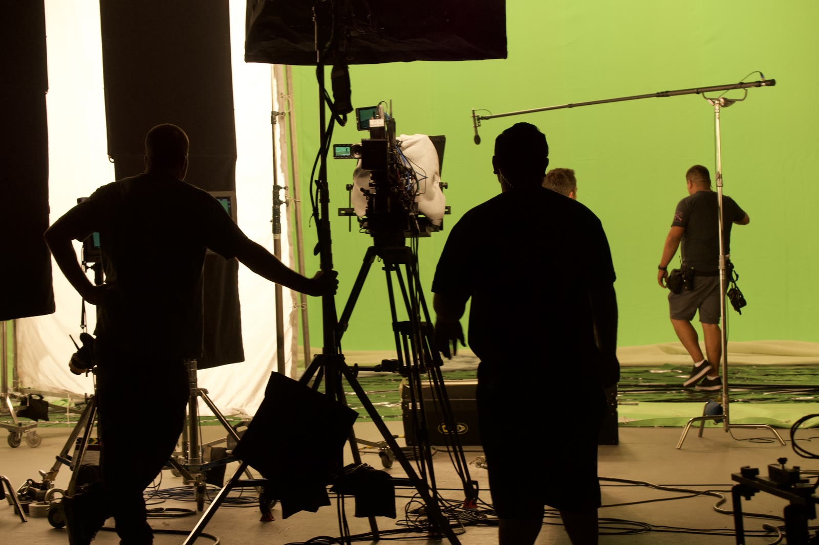 Crew and lighting rigs in front of a green screen on the Sony soundstage
