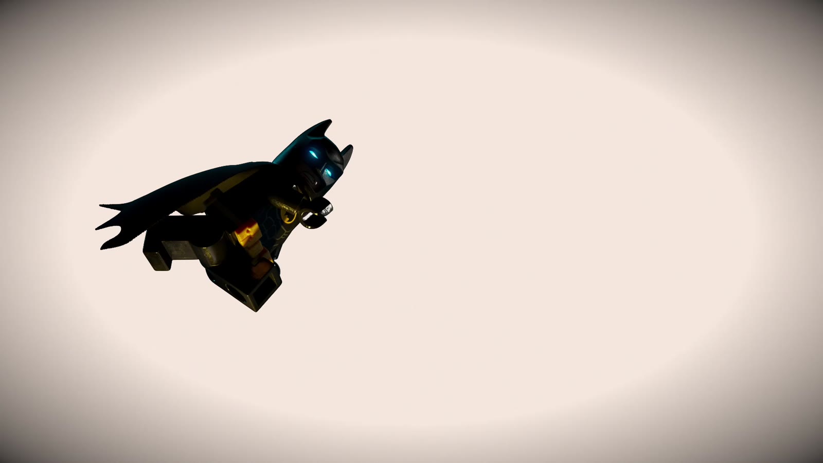 Lego Batman gliding with cape spread against a white background